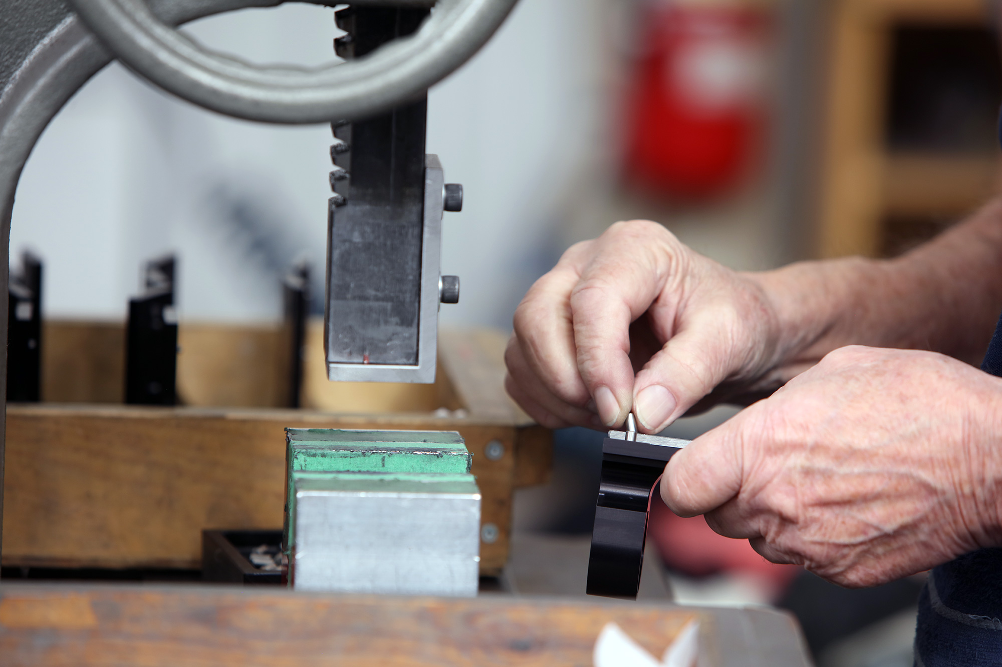 close up of two hands operating a machine