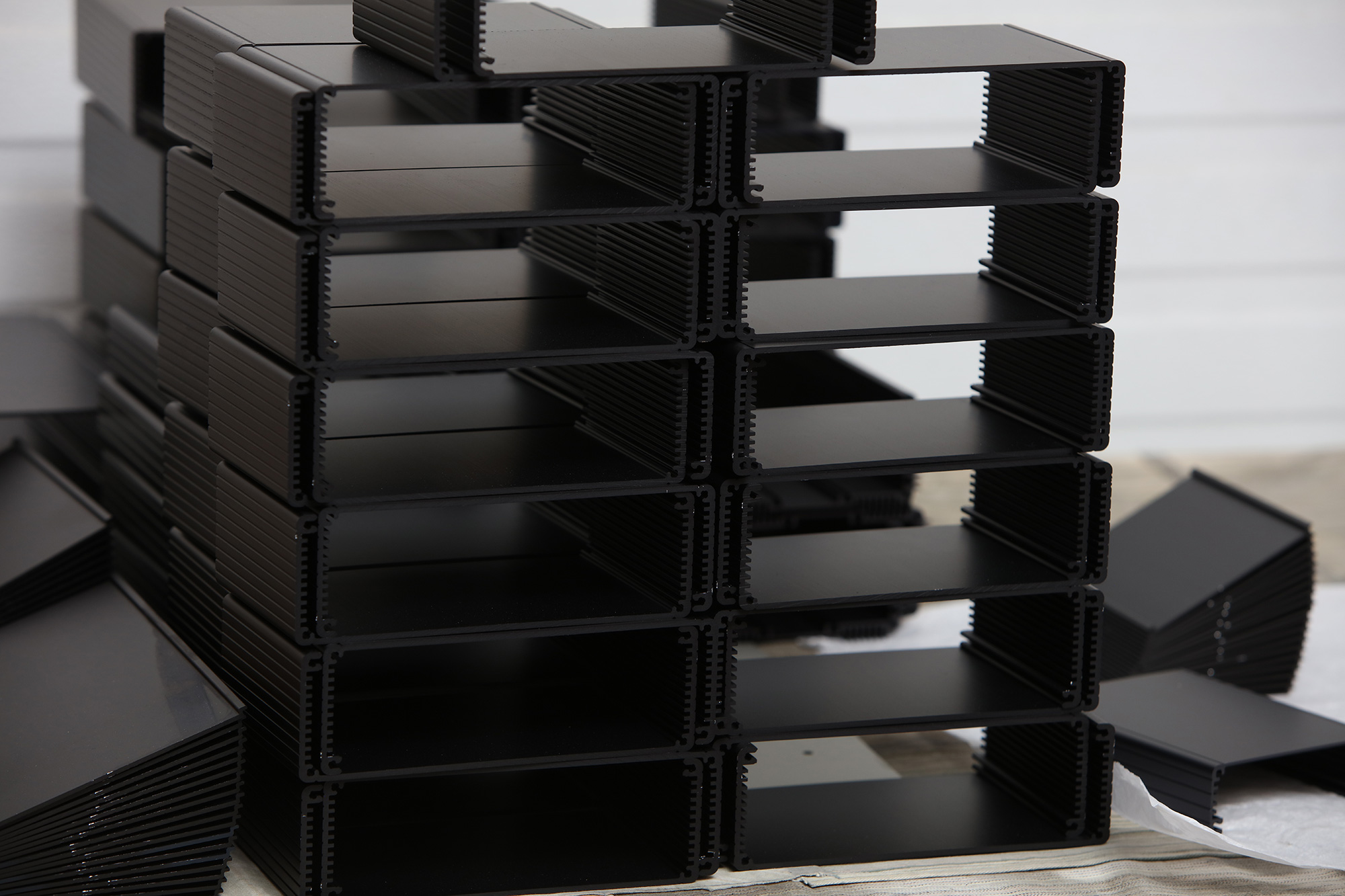 stacks of anodized products with a black finish