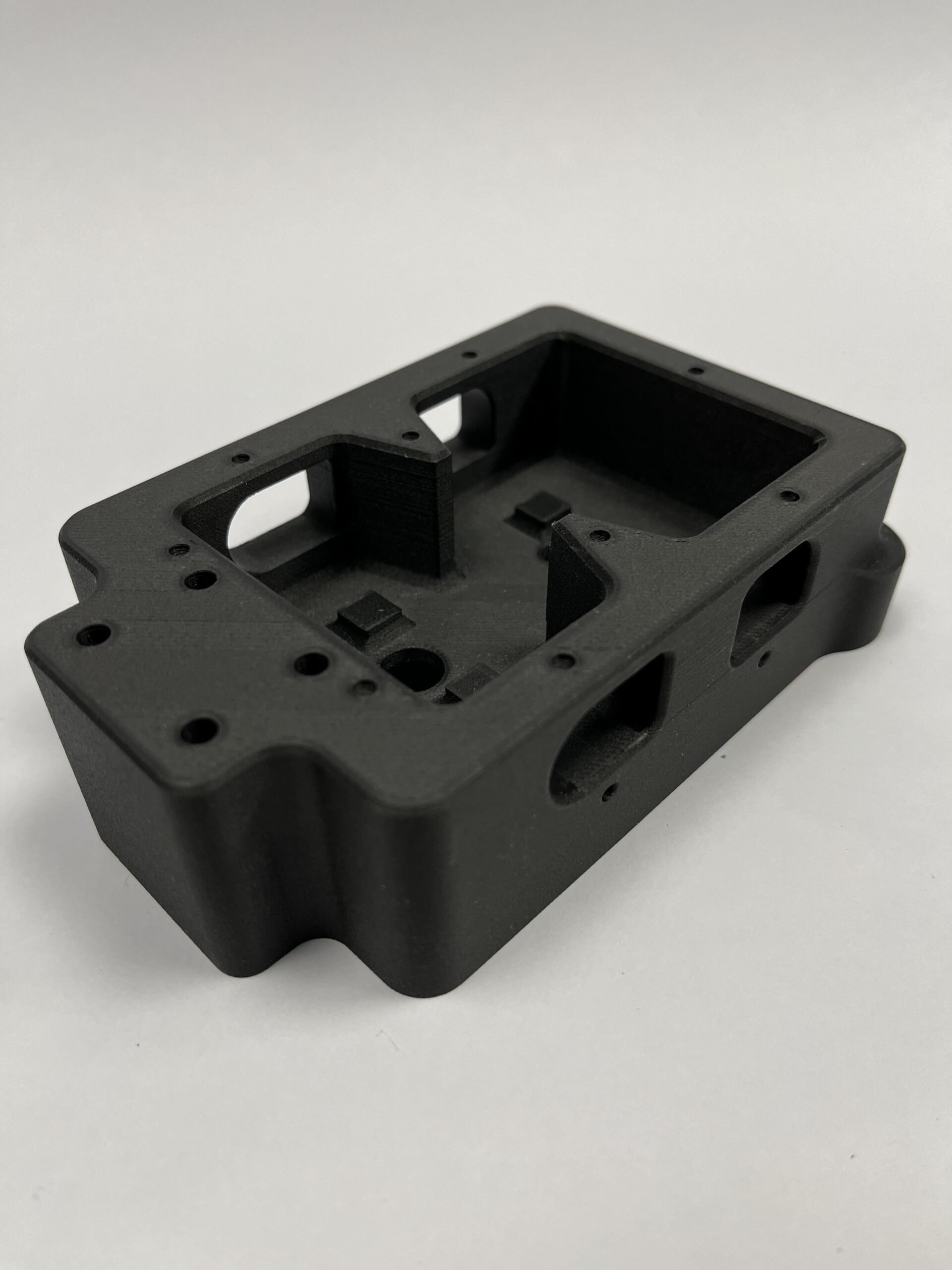 a 3D printed square black composite